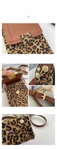 Detail view of leopard print mini phone bag featuring gold hardware and magnetic flap closure