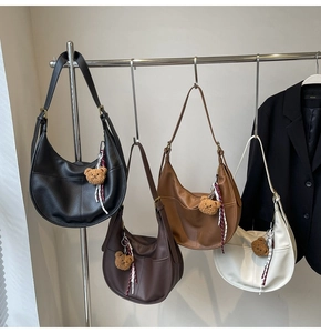 Hobo shoulder bags in four colors featuring pebble texture and plush bear charms