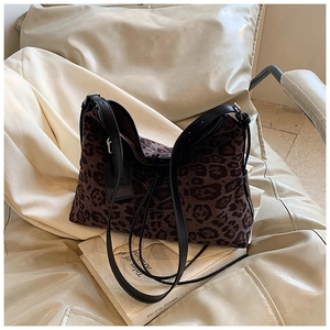 Close-up of leopard print hobo bag with black leather strap and Fashion hangtag details