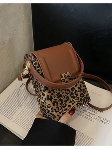 Mini leopard print crossbody phone bag with brown leather trim and metal rivets
