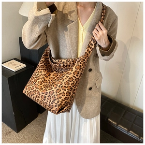 Close-up of the vintage leopard print texture on a large capacity hobo shoulder bag