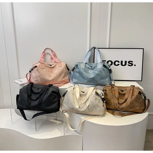 Multi-color travel duffel bags in five soft shades for gym and short trips