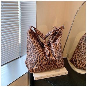 Detailed view of leopard print hobo bag with wide shoulder strap and large capacity