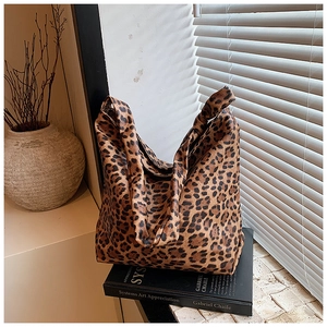 Detail of vintage leopard print tote bag showing premium leather texture and pattern