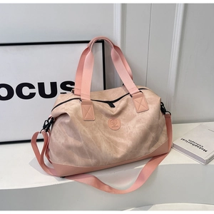 Detail of pink marble textured travel bag with sturdy handles and adjustable strap
