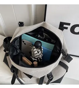 Top view of open travel bag interior showing multiple pockets for tablets and umbrellas