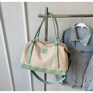 Sac de voyage en toile grande capacité avec poignées en cuir vert menthe et bandoulière
