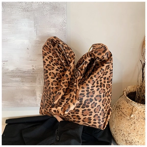 Close-up of leopard print bucket bag with large capacity in a stylish home setting