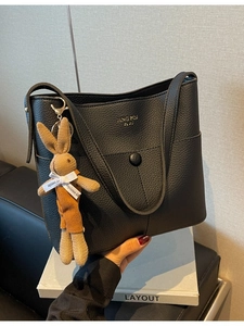 Fashionable black lychee grain leather tote bag with elegant brown rabbit charm
