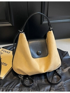 Versatile suede tote bag in khaki and black with round buckle and adjustable strap
