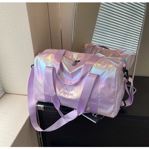 Detail view of pearlescent purple travel bag showing high-shine iridescent texture and logo
