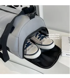 Detailed view of grey gym bag featuring a side independent shoe compartment with zipper