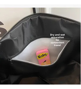 Internal view of gym bag showing wet-dry separation waterproof compartment and zippers