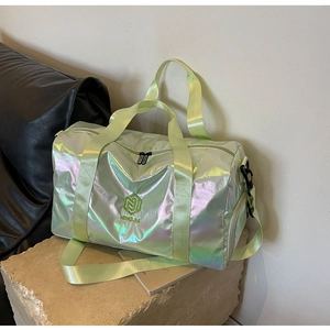 Detailed macro of holographic fitness bag with side zipper pocket and logo on stone base