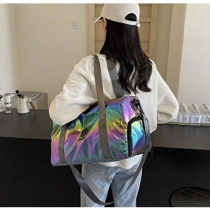 Close-up of iridescent pearlescent travel bag with dual handles and detachable shoulder strap
