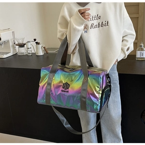 Macro detail of holographic travel bag showing iridescent fabric and side zipper pocket