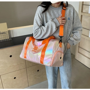 Iridescent pink travel bag with orange straps and side zipper compartment for gym use