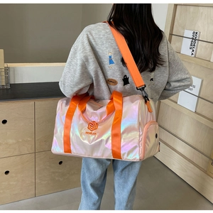 Detailed view of iridescent laser PU fabric travel bag with orange straps and side compartment