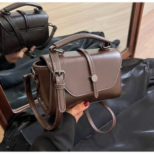 Detailed front and back view of a retro dark brown glossy leather crossbody bag with metal clasp