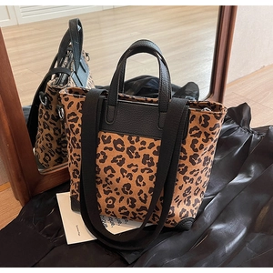 Leopard print tote bag detail showing dual straps and durable reinforced leather corners