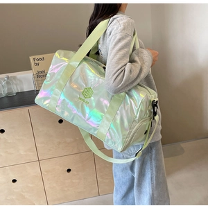 Iridescent travel bag detail showing smooth holographic finish and mint green straps