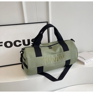 Detail view of large capacity green sports bag with dry wet separation and side zipper