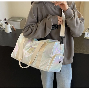 Detailed shot of the holographic travel bag featuring a separate wet compartment and shoe pocket