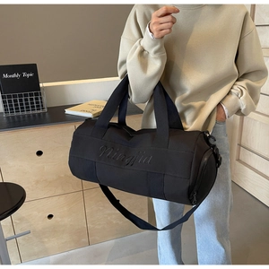 Detailed view of black nylon fitness bag with elegant Ningjia 3D embroidery detail
