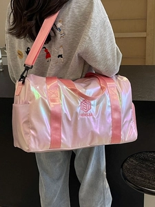 Pink holographic duffel bag for fitness and travel with adjustable crossbody strap