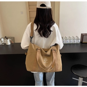 Grand sac de voyage en toile kaki avec logo NINGJIA, bandoulière réglable et poignée robuste