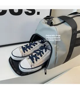 Travel bag with separate shoe compartment for sneakers and durable grey fabric