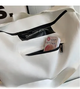 Detail view of large travel bag showing side zipper pocket with storage capacity