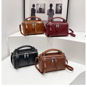 Vue détaillée de sacs oreillers élégants en quatre couleurs avec fermetures éclair