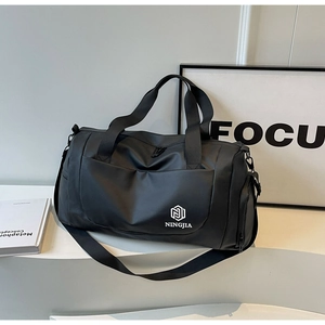 Detail of waterproof nylon gym bag with reinforced handles and removable shoulder strap