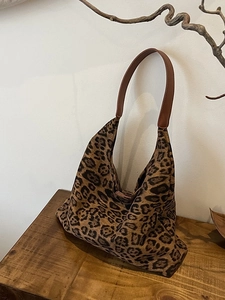 Stylish large leopard print tote bag with brown faux leather strap for autumn fashion