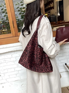 Fashionable burgundy leopard print tote bag with matching pouch for autumn styling