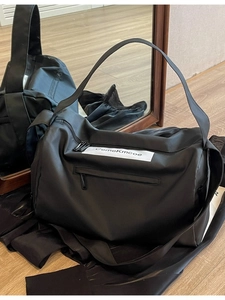 Large black sports gym bag with front zipper and brand patch for travel and fitness