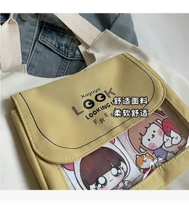 Detail of canvas tote bag with contrast yellow pocket and transparent PVC window design