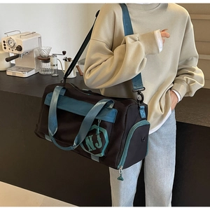 Sac de sport en nylon noir et bleu paon avec logo NJ et poche zippée fonctionnelle