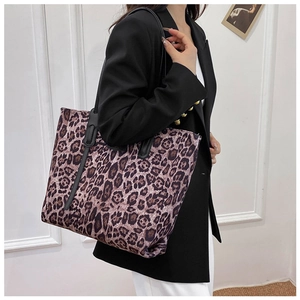 Leopard print tote bag shown on model highlighting the large capacity and stylish design