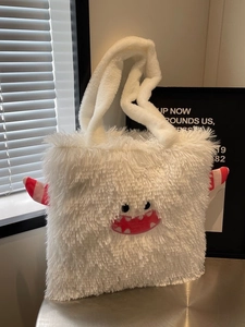 Sac fourre-tout monstre en peluche blanche avec yeux de dessin animé et cornes rayées