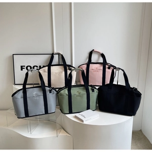 Detailed display of lightweight yoga tote bags in grey, beige, pink, green, and black