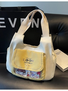 Minimalist beige canvas tote bag with yellow pocket and transparent PVC window for pins
