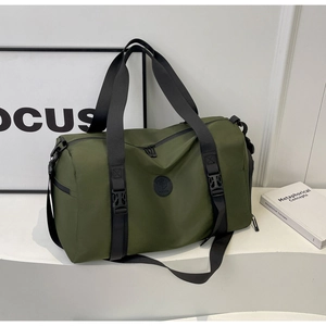 Detail view of army green travel bag with water-resistant nylon fabric and black straps