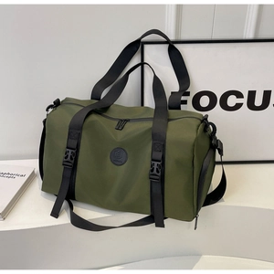 Detail view of military green waterproof nylon travel bag with durable straps and buckle