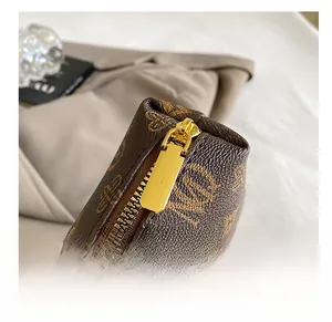 Macro detail of high-quality smooth metal zipper and monogram leather texture on retro tote bag