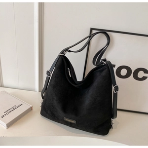 Chic black PU leather hobo shoulder bag with silver buckles and a fashion metal plate