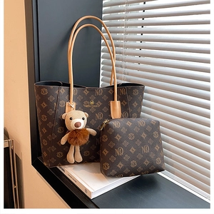 Brown monogram tote bag set with leather handles and a cute bear keychain accessory