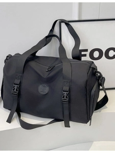 Versatile black travel bag with dry-wet separation and adjustable shoulder strap