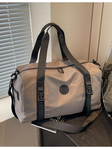 Large khaki travel bag with waterproof nylon fabric and adjustable strap for sports and gym